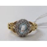 18ct GOLD AQUAMARINE & DIAMOND CLUSTER RING, principal oval aquamarine surrounded by brilliant cut