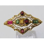 18CT YELLOW GOLD MULTI GEM STONE SET BROOCH, including citrine, peridot & ruby