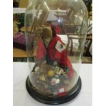 ANTIQUE PEDDLER DOLL, glass domed peddler doll with large display of wares, cork faced, 37cm height