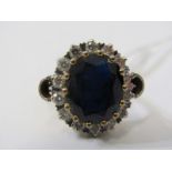SPECTACULAR SAPPHIRE & DIAMOND CLUSTER RING, large oval sapphire with 12m spread, surrounded by 14