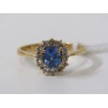 18ct YELLOW GOLD SAPPHIRE & DIAMOND RING, principal oval cut sapphire surrounded by brilliant cut