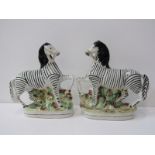 STAFFORDSHIRE POTTERY, pair of 19th Century pottery Zebras, one head badly damaged, 22cm height