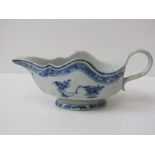 ORIENTAL CERAMICS, Nanking blue floral and garden decorated sauce boat, overall length 23cm