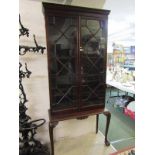 GEORGIAN MAHOGANY GLAZED TWIN DOOR NARROW BOOKCASE on carved cabriole leg ball and claw feet base,