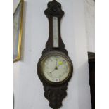 EDWARDIAN ANEROID BAROMETER, carved oak casing with inset thermometer, 90cm height
