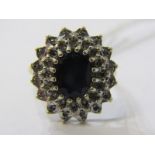 9ct YELLOW GOLD SAPPHIRE & DIAMOND CLUSTER RING, principal oval cut sapphire surrounded by