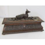 BLACK FOREST CARVED OAK CASKET, with Couchant Stag on oak leaf and acorn detailed carved base (