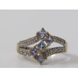 9ct YELLOW GOLD TANZANITE & DIAMOND CLUSTER RING, unusual geometric Z pattern of princess cut