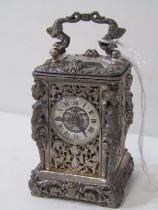 MINIATURE CARRIAGE CLOCK by Charles Oudin, ornate silvered casing with caryatid column supports