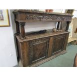 CARVED OAK COURT CUPBOARD, twin cupboard base and pair of frieze drawers, with foliate carved