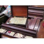 MAH JONG, walnut cased bone and bamboo counters, with additional storage racks etc.