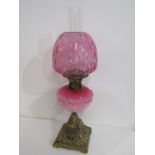 ANTIQUE OIL LAMP, ornate brass square base oil lamp with pink milk glass reservoir and cranberry