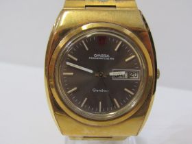 OMEGA MEGAQUARTZ 32 KHZ ELECTRONIC MOVEMENT WRIST WATCH, day date aperture, gold plated case and