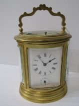 REPEATER CARRIAGE CLOCK, oval cased bevel glass carriage clock with coiled bar strike and