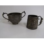 EASTERN SILVER, an Eastern silver twin handled cup with floral decoration 143 grams, also a white