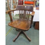 OAK OFFICE CHAIR, 1930's oak swivel office chair on brass casters