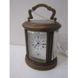 MINIATURE OVAL CASED BRASS CARRIAGE CLOCK, with alarm bell base "L'Epee", 8.5cm height