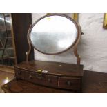 GEORGIAN MAHOGANY SWING DRESSING MIRROR, triple drawer base with bone inset shaped mirror