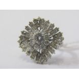 IMPRESSIVE 18ct WHITE GOLD DIAMOND BALLERINA STYLE CLUSTER RING, principal brilliant cut diamond