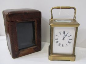 JACOT BRASS CASED CARRIAGE CLOCK with plain enamel face and bevelled glass windows, 14cm height,