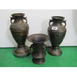EASTERN METALWARE, pair of Japanese bronzed twin handled 24 cm relief decorated vases (1 with