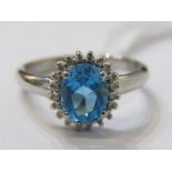 18ct WHITE GOLD TOPAZ & DIAMOND CLUSTER RING, vivid blue oval cut blue topaz surrounded by brilliant