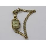 VINTAGE 9ct YELLOW GOLD LADY'S COCKTAIL WATCH BY ACCURIST, on 9ct yellow gold bracelet,