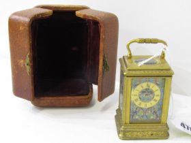 CHAMPLEVE MINIATURE BRASS CASE CARRIAGE CLOCK with engraved brass casing and travel case, 8cm height