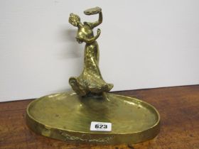 ANTIQUE BRASSWARE, oval based ashtray with female tambourine player finial, 17cm height