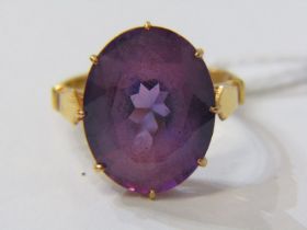 22ct RING, 22ct yellow gold ring, set an oval purple stone, approx. 15mm diameter, size J/K