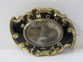 VICTORIAN MEMORIAL BROOCH, oval brooch with picture locket to centre, set in black enamel and