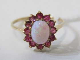 OPAL & RUBY CLUSTER RING, 9ct yellow gold ring, set an oval opal, surrounded by a cluster of rubies,