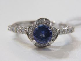 TANZANITE & DIAMOND CLUSTER RING, 18ct white gold ring set a central circular tanzanite, within a