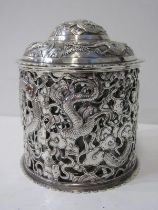 CHINESE CYLINDRICAL LIDDED POT, the pierced body decorated with dragons in a flowering tree, lid
