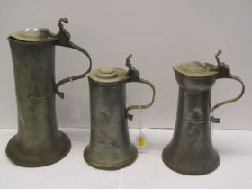 CONTINENTAL PEWTER, set of 3 graduated narrow bodied lidded flagons, largest dated 1787
