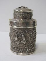 INDIAN SILVER TEA CADDY, the circular body decorated dancing figures in relief, lid decorated