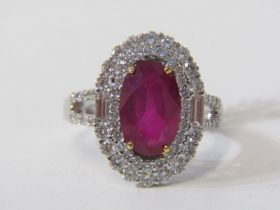 IMPRESSIVE RUBY & DIAMOND CLUSTER RING, 18ct white gold ring set a large oval ruby with approx. 11mm