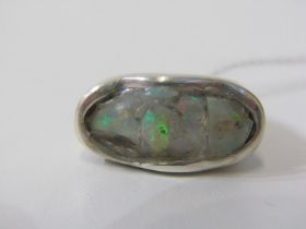 HAND MADE OPAL RING, a large oval ring in a hand made silver setting, size M/N
