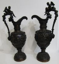 EUROPEAN METALWARE, pair of renaissance design bronze ewers with Bacchanale relief decoration,