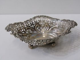 SILVER BON BON DISH, with pierced foliate decoration on 4 bun feet and lion mask handles, Chester