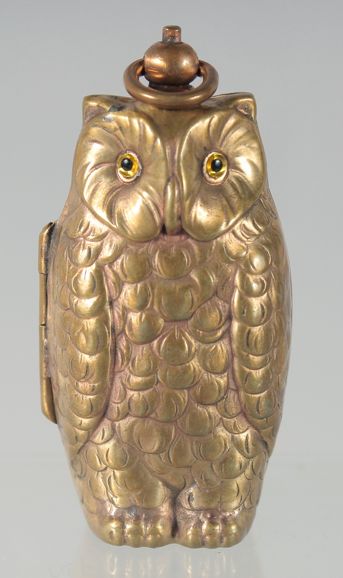 A BRASS OWL DOUBLE SOVEREIGN CASE, 6 cm.