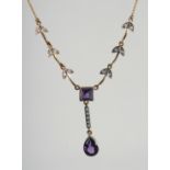 A 9ct. GOLD AND SILVER AMETHYST AND DIAMOND NECKLACE.