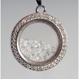 A SILVER CUBIC ZIRCONIA FLOATING PENDANT NECKLACE.