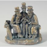 A BRONZE JUDAICA GROUP OF THREE MEN, 5 cm.