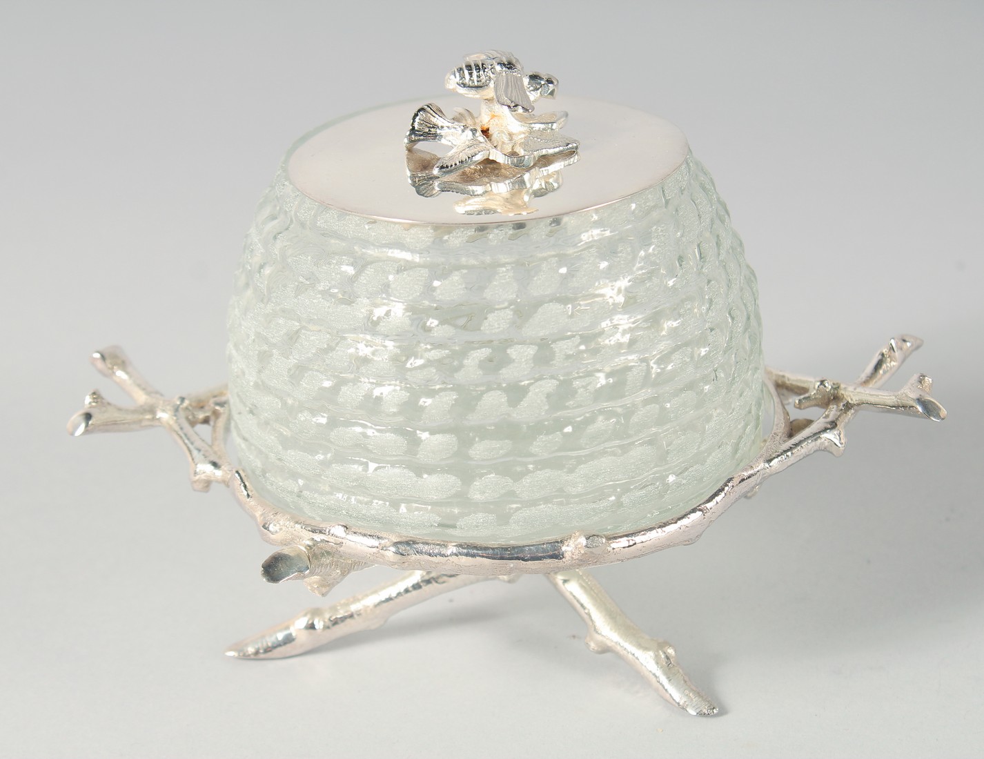 A SILVER PLATED HONEY POT FORMED AS A BEEHIVE.