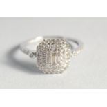 A 9ct. GOLD DIAMOND SET DECO STYLE SQUARE RING.