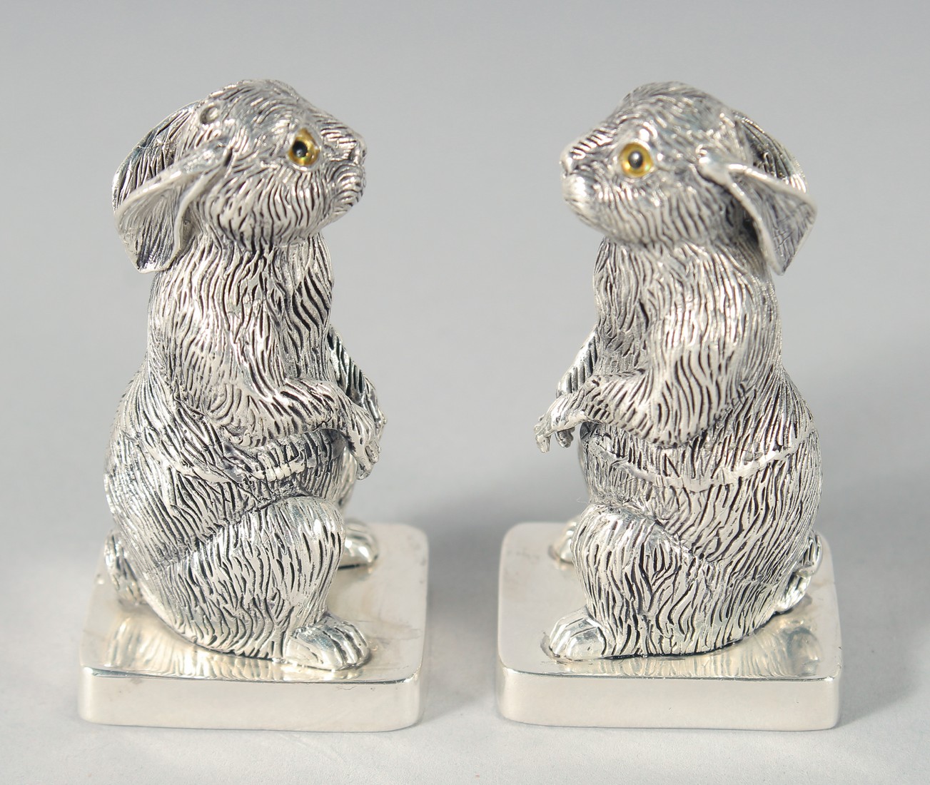 A PAIR OF SILVER PLATED RABBIT SALT AND PEPPERS, 5.5 cm. - Image 2 of 3