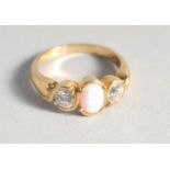 A SILVER 18ct. GOLD PLATED OPAL AND CUBIC ZIRCONIA RING.