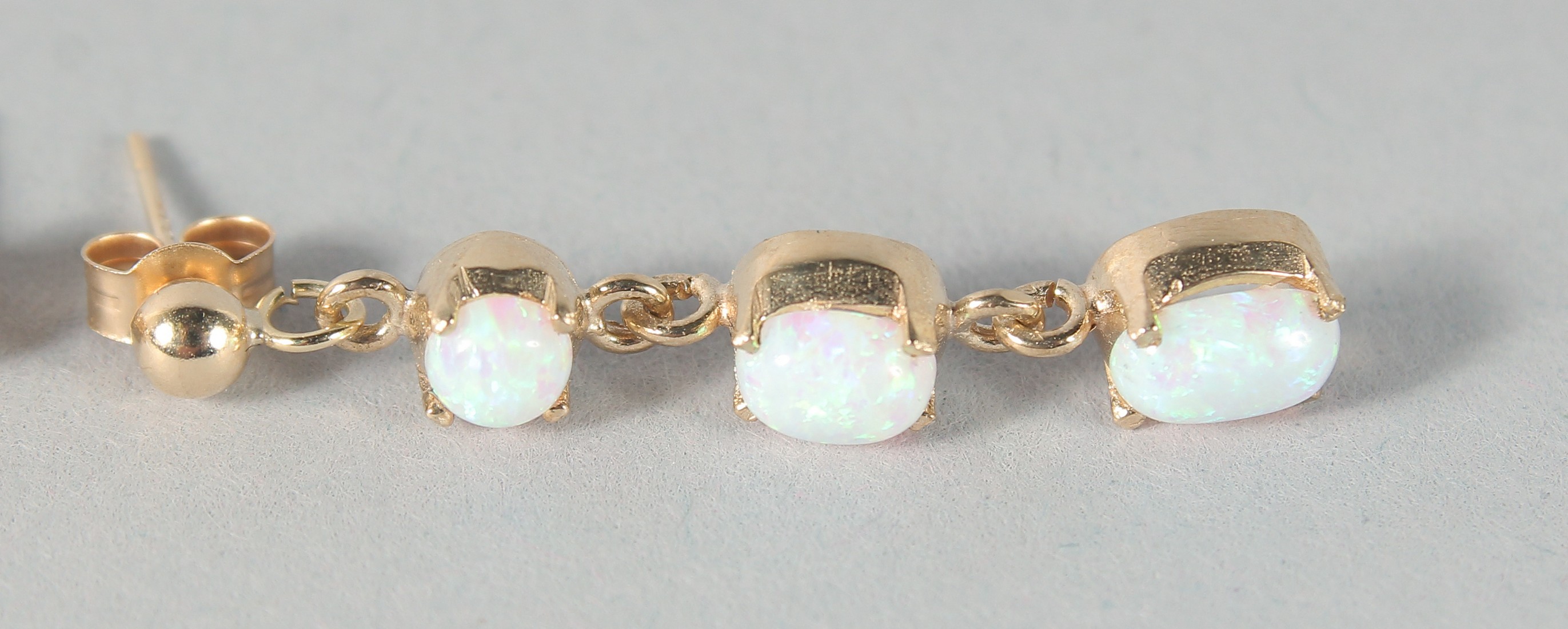 A PAIR OF 9ct. GOLD THREE OPAL DROP EARRINGS. - Image 3 of 3