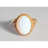 A SILVER 18ct. GOLD PLATED OVAL OPAL RING.